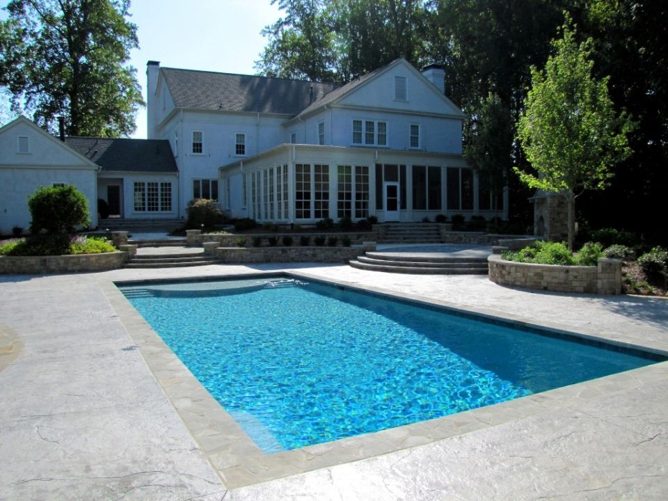 Pool with Irregular Gray flagstone and charcoal stamped deck