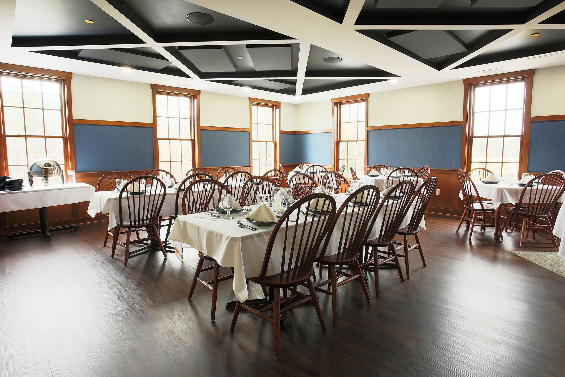A large room with tables and chairs in it