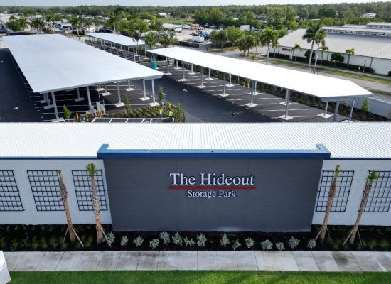 The Hideout Nursing Home exterior with covered parking and white-roofed walkways
