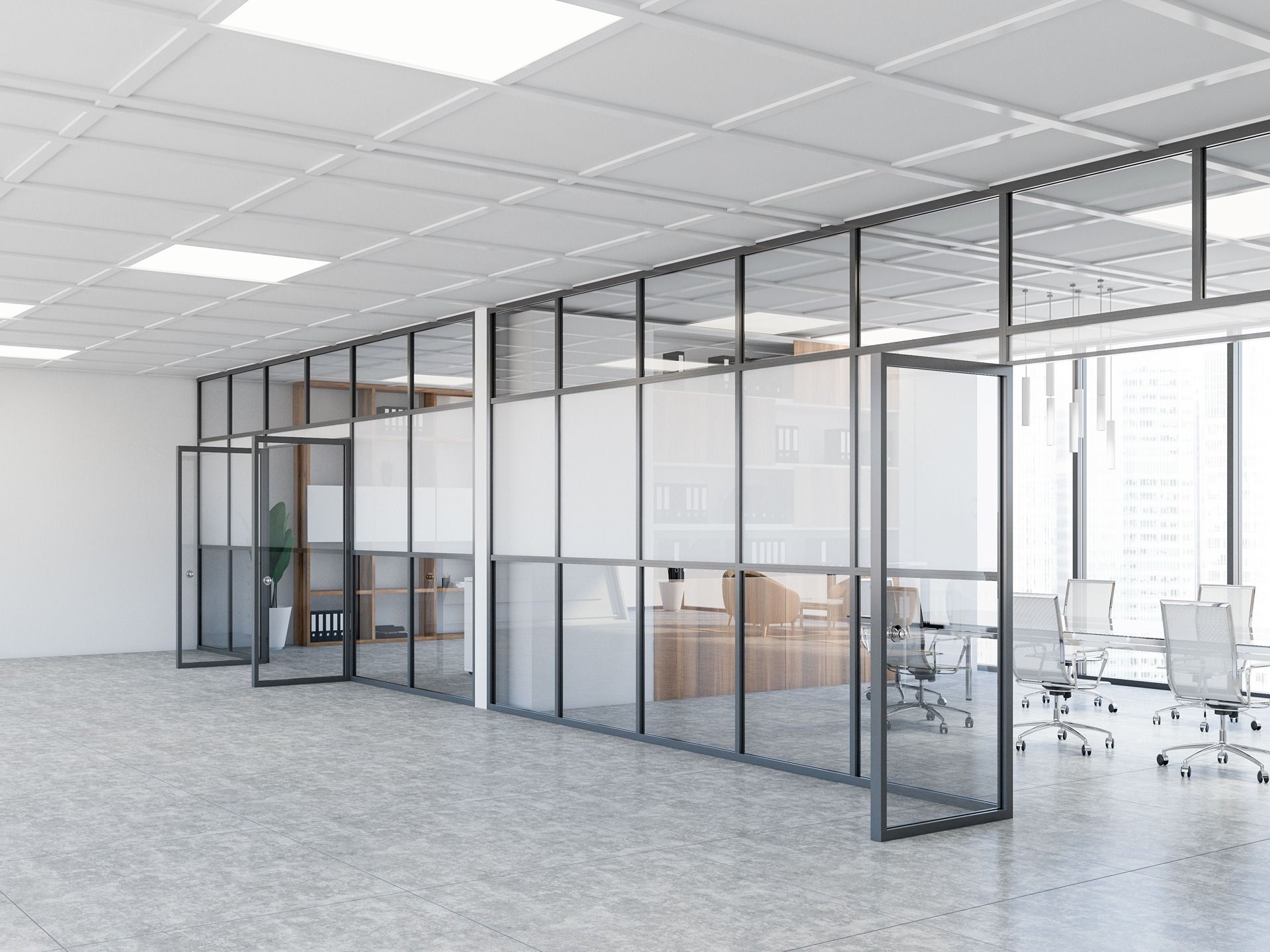 Modern glass-walled office conference room with desks and white chairs in a bright open workspace