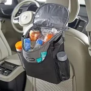 The trunk of a car is filled with boxes and bottles.