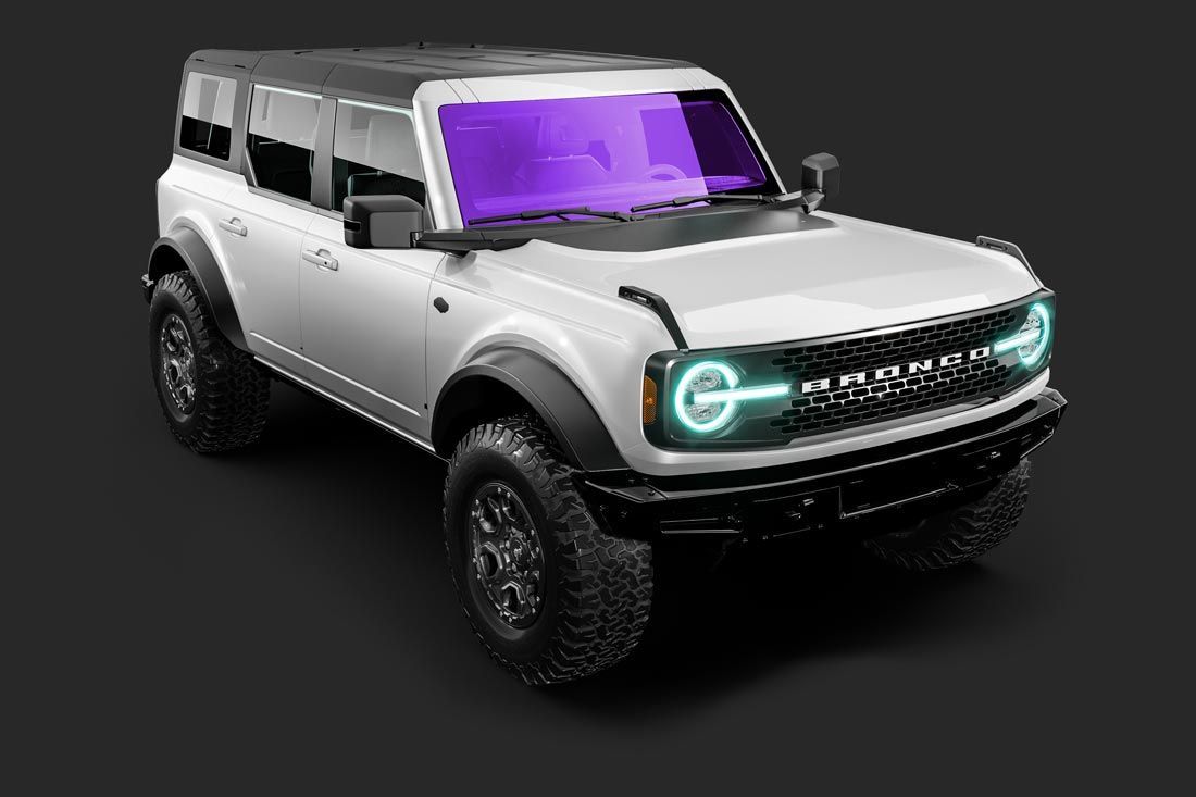 A white ford bronco with a purple windshield is on a black background.