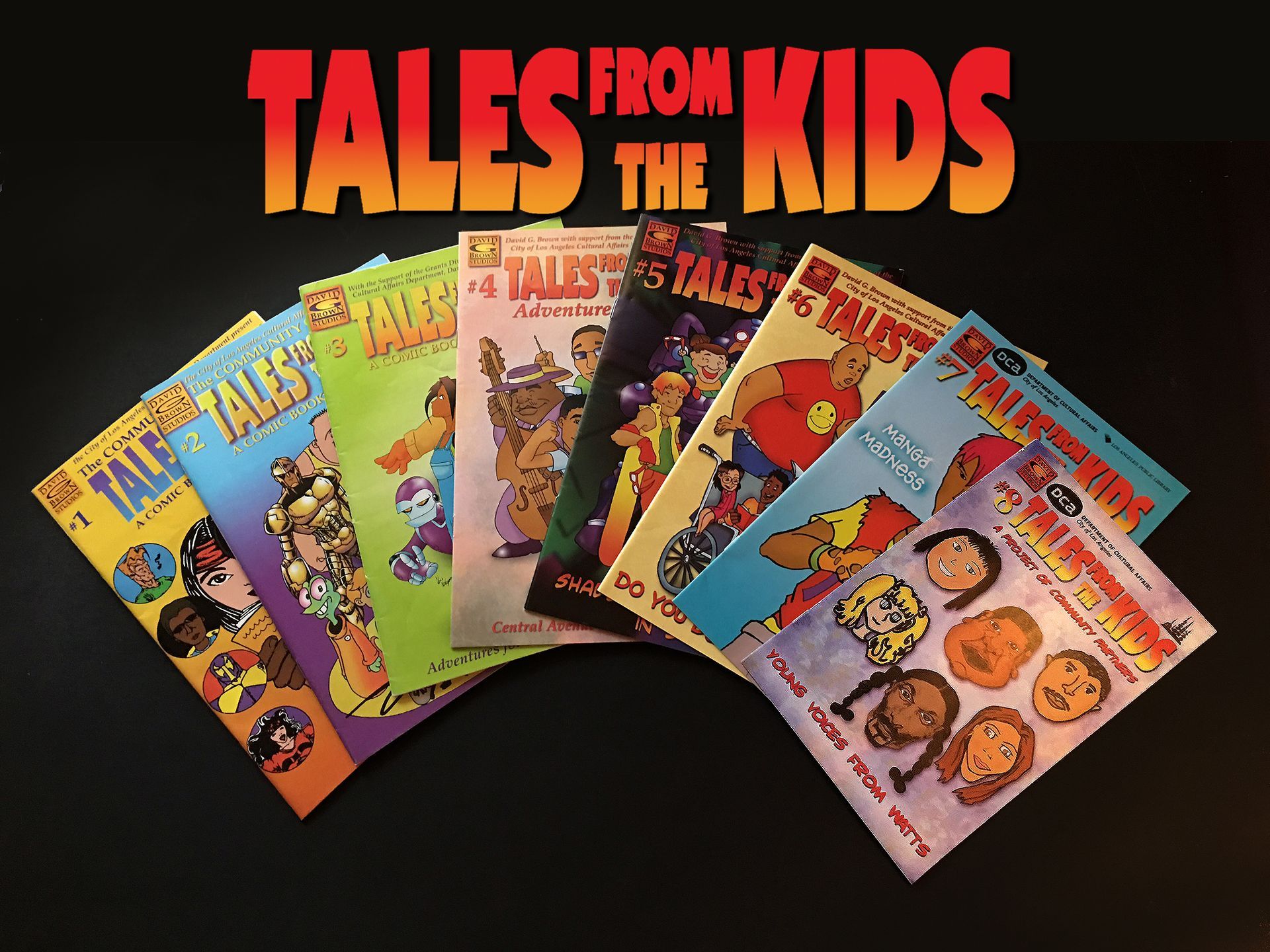 Comic book covers fanned out, titled 