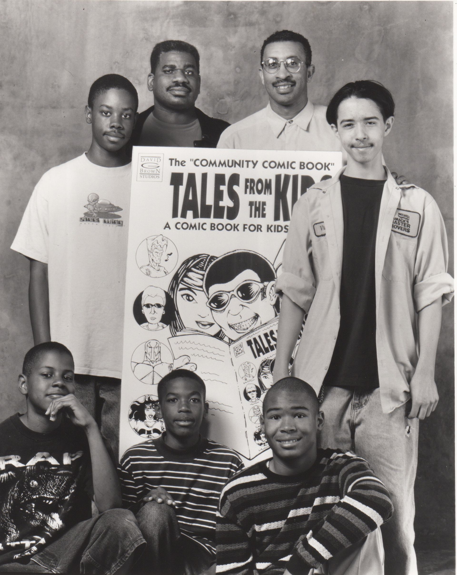 Group of young men pose with