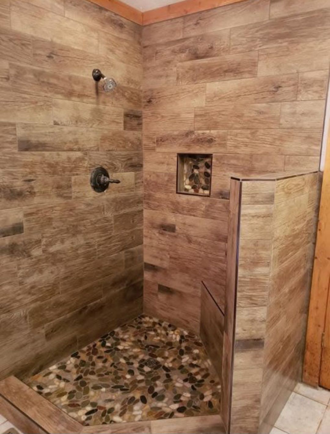 A person is working on a wooden desk with a screwdriver.