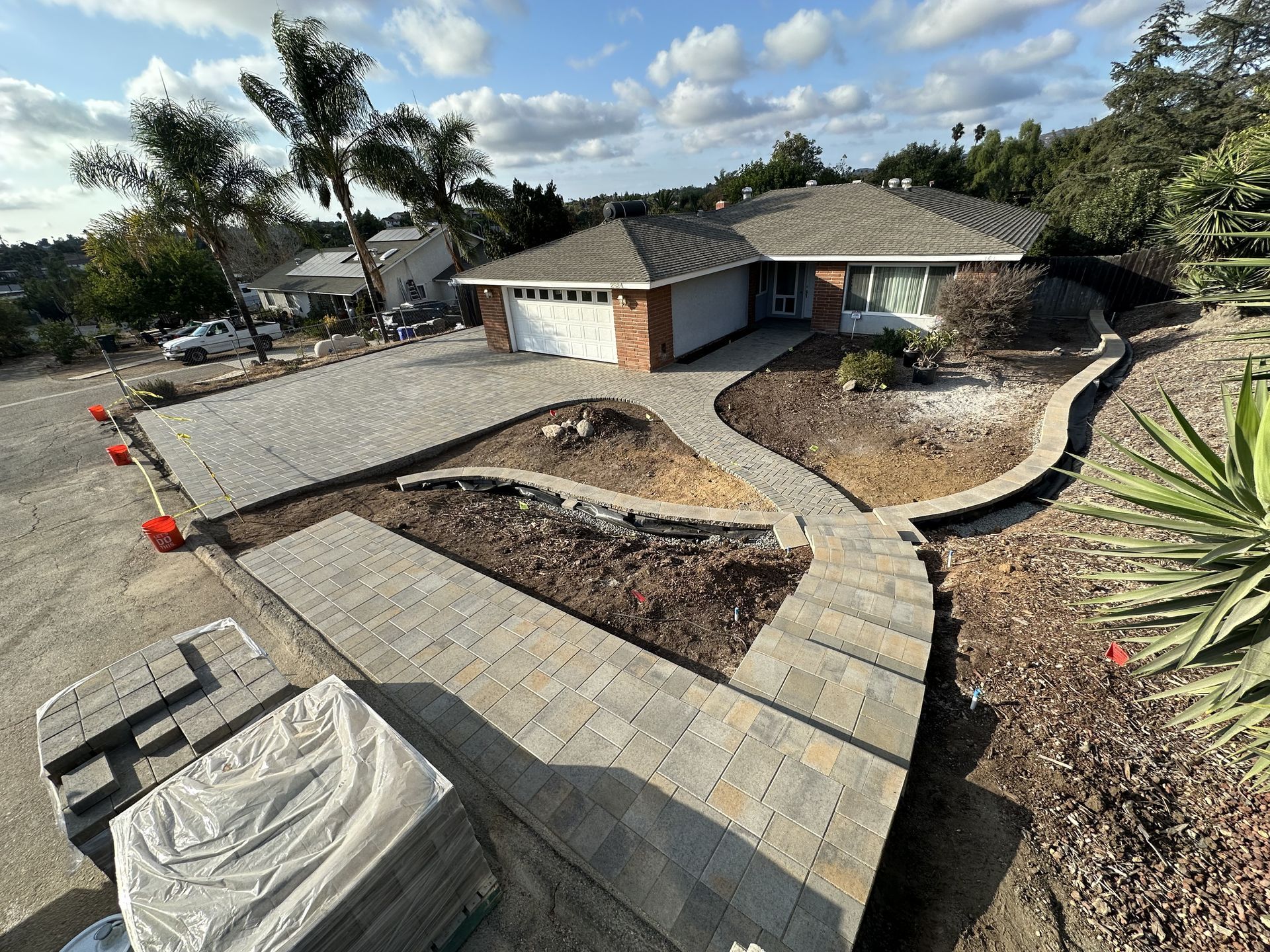A house with a driveway that is being built