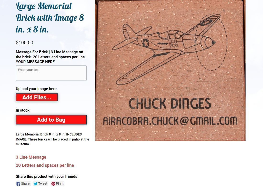 Large brick with an airplane drawing, name 