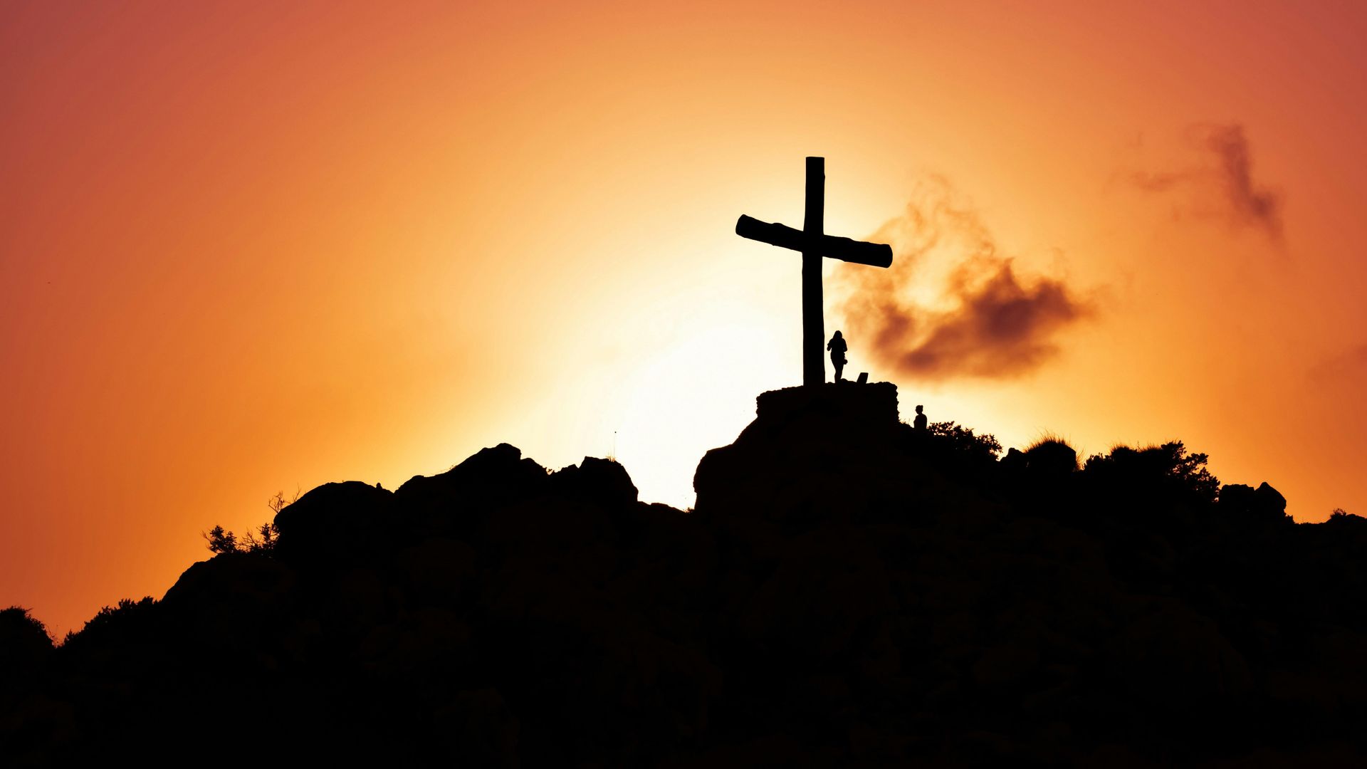 The cross against an orange sky