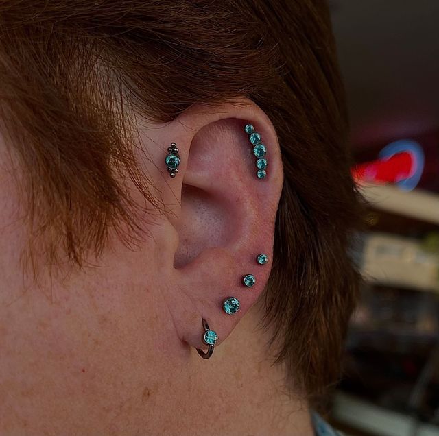 Tragus, Outer Conch, Lobe and Upper Lobes with Blue Diamond Earrings - Manhattan, NY - Studio 28 Tattoo