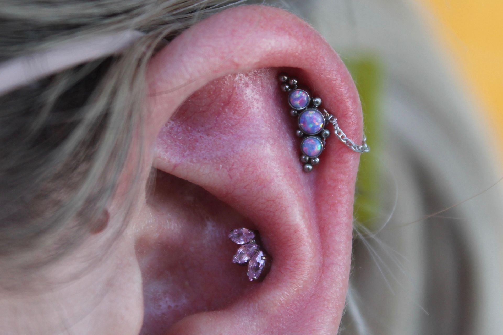 A close up of a person 's ear with a piercing - Manhattan, NY - Studio 28 Tattoo