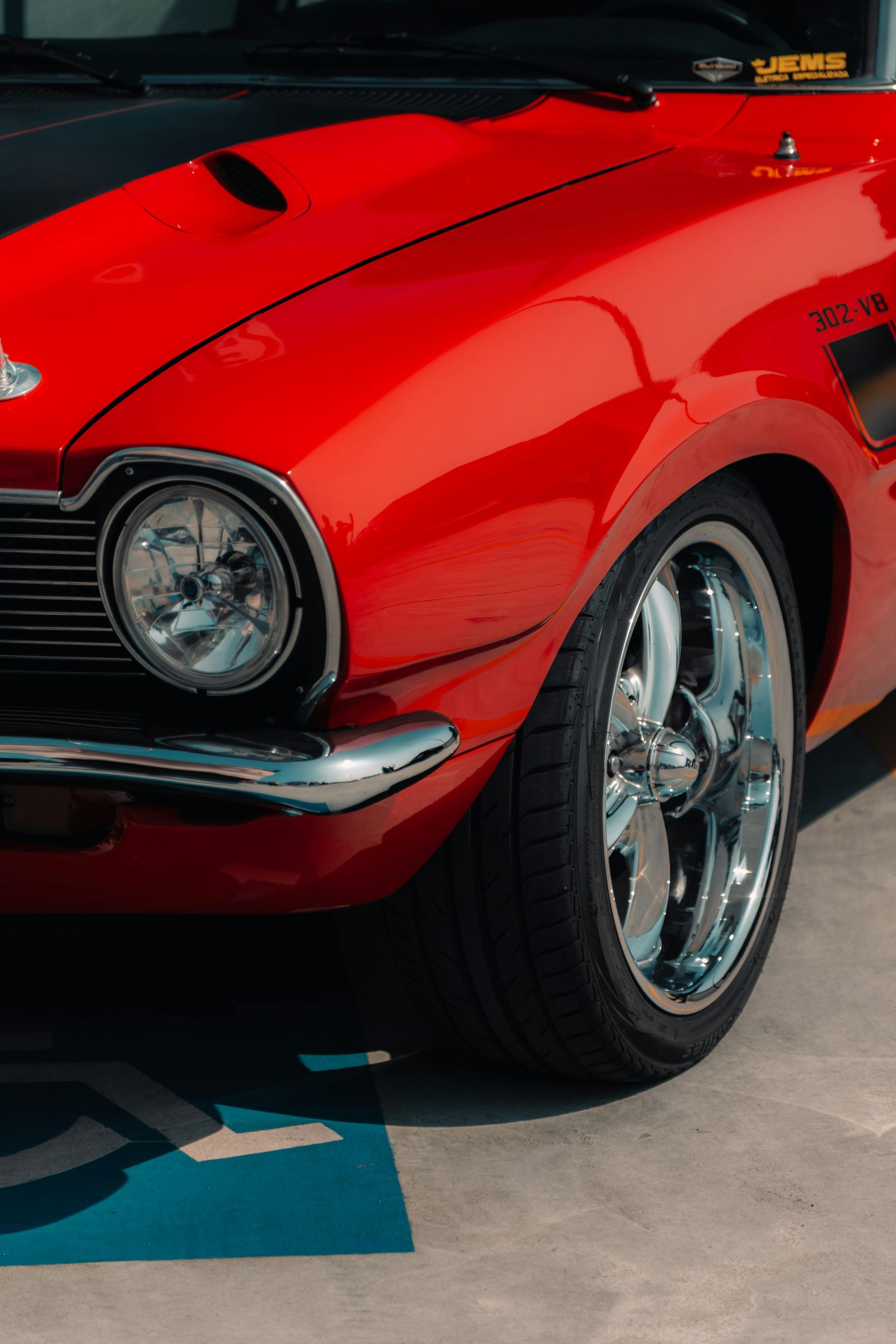 Woman in a blazer smiles, looking at the camera.