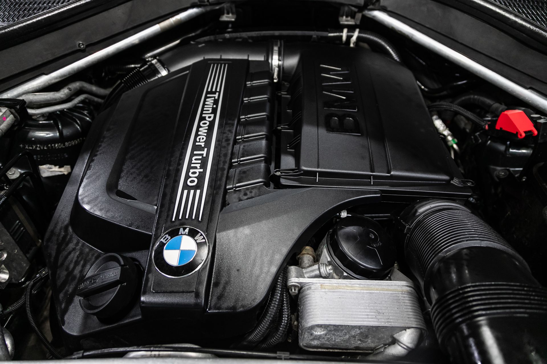 A close up of the engine of a bmw x5.