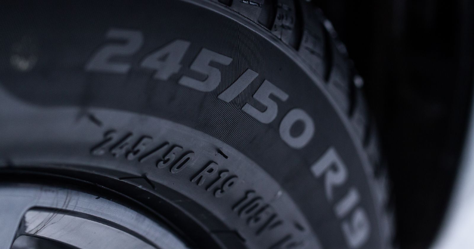 a close up of a tire showing the tire size to accompany an article about this topic