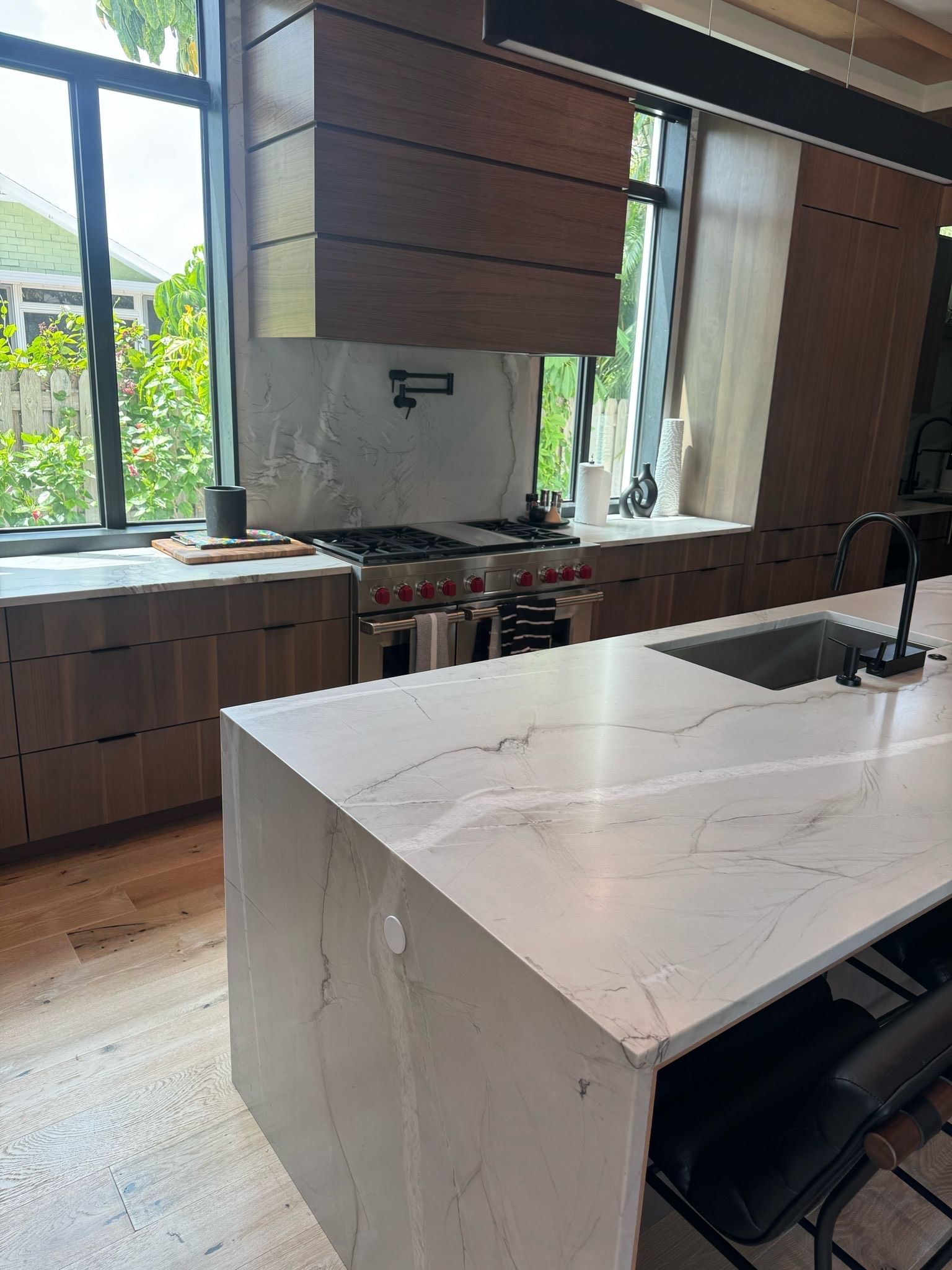 There is a large island in the middle of the kitchen.