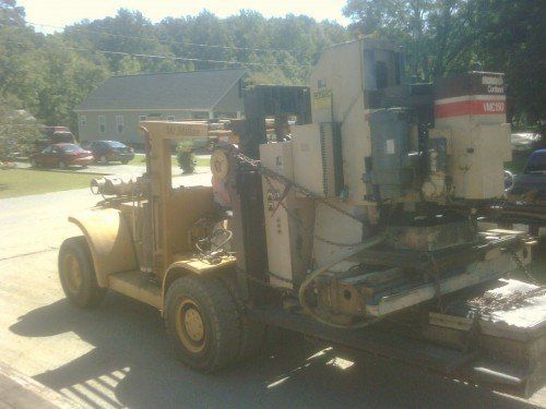 Forklift With A Machine - Dallas, NC - McMillan Crane Services Inc.