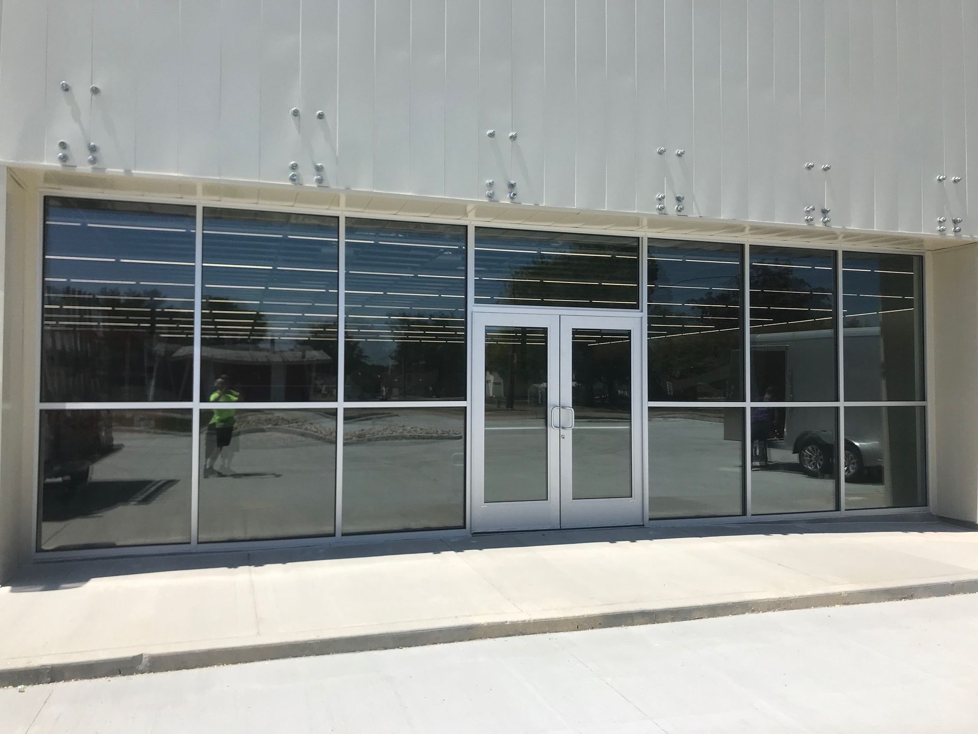 A building with a lot of windows and a door.