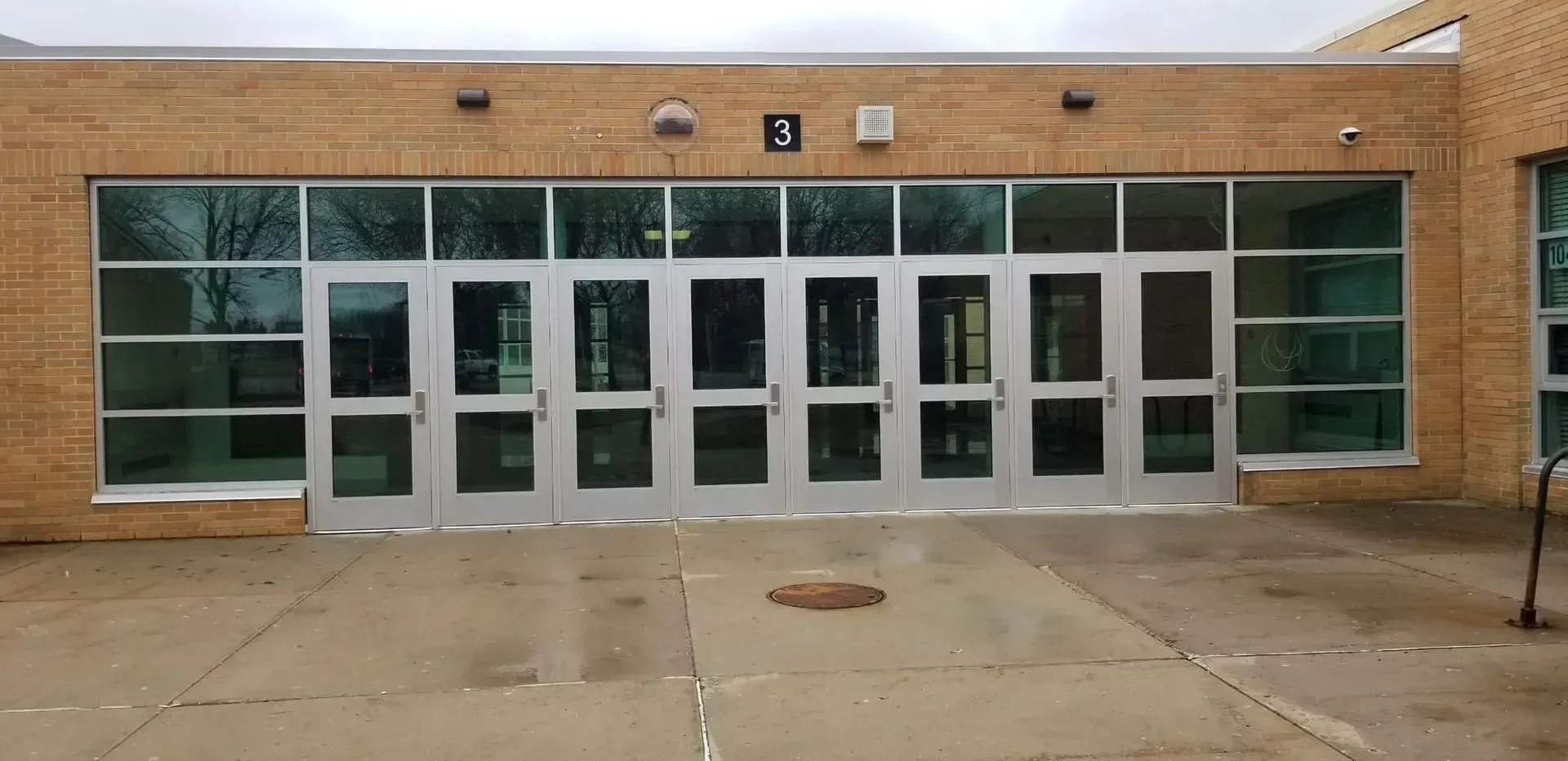 A large brick building with a lot of windows and doors.