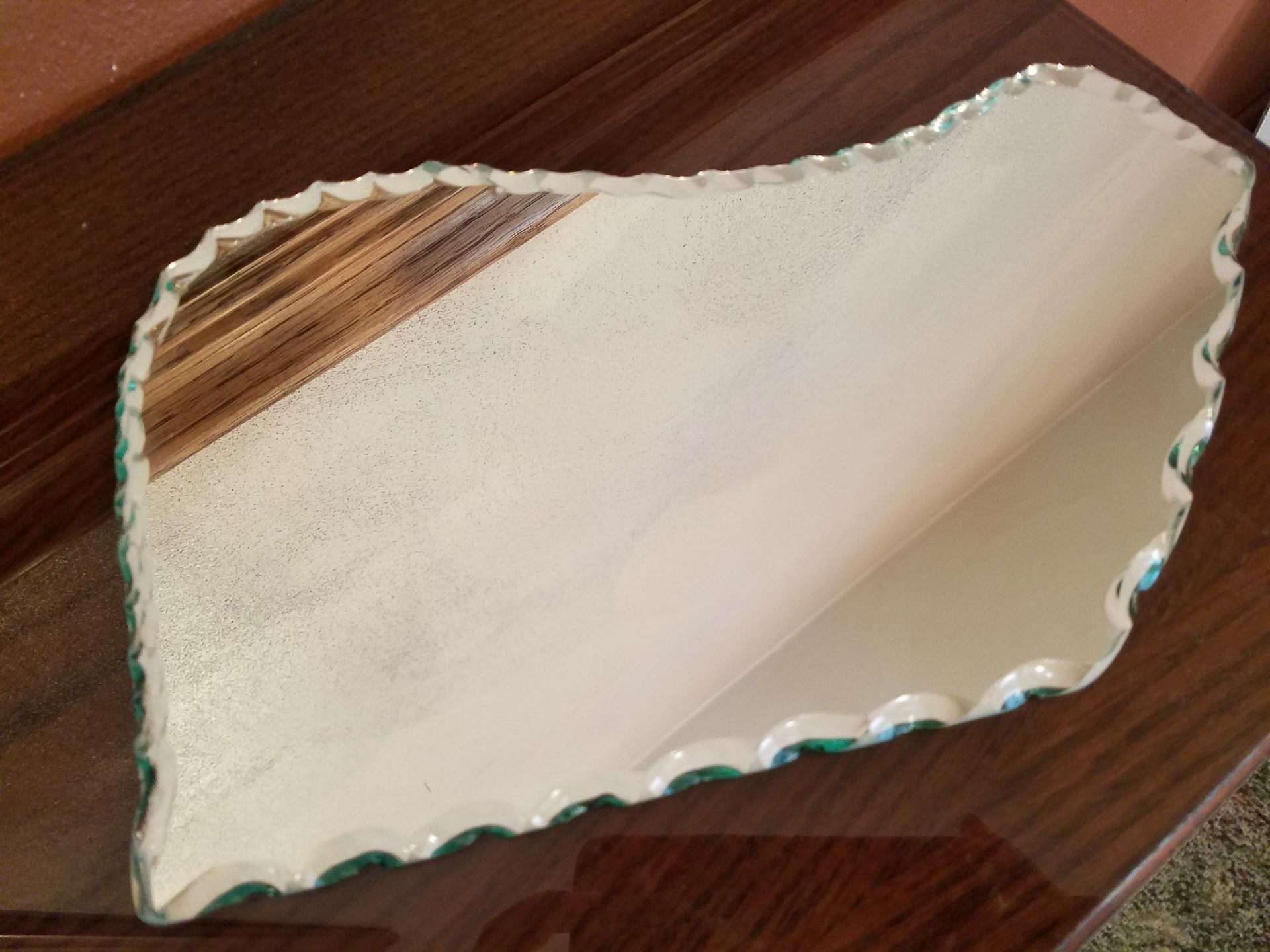 A piece of paper is laying on a wooden table.