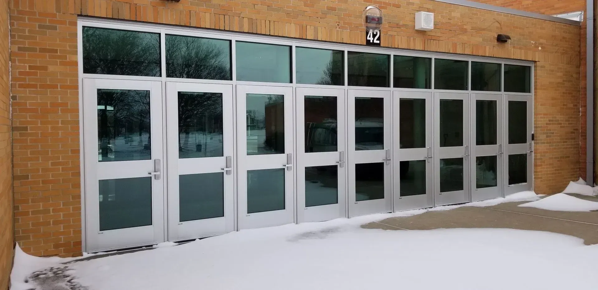 A brick building with a lot of doors and windows
