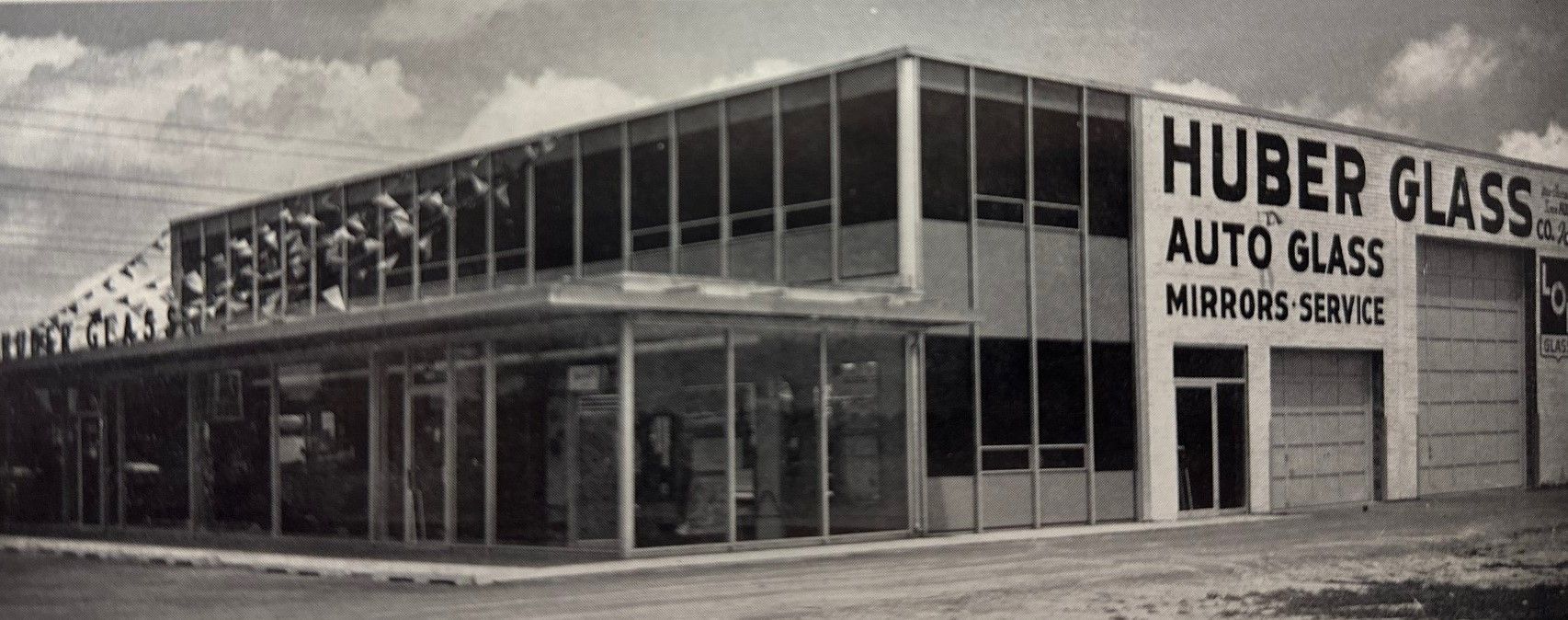 A black and white photo of huber glass auto glass