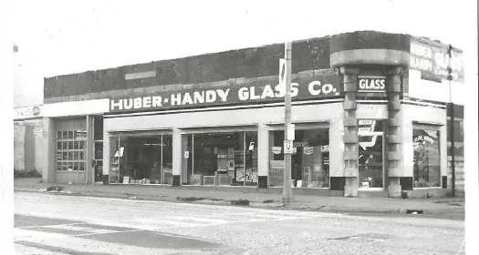 A black and white photo of the huber handy glass co.