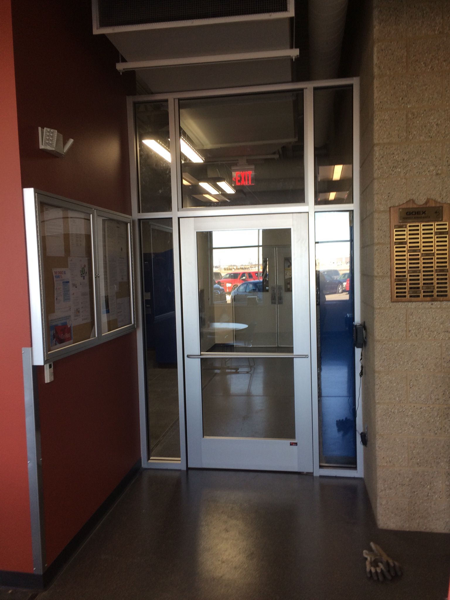 A building with a red exit sign above the door