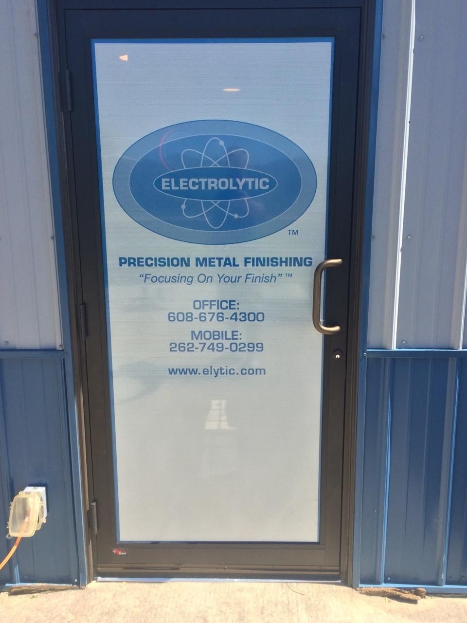 A door with a sign on it that says electrolytic precision metal finishing