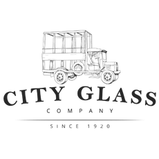 The city glass company logo is a black and white drawing of an old bus.