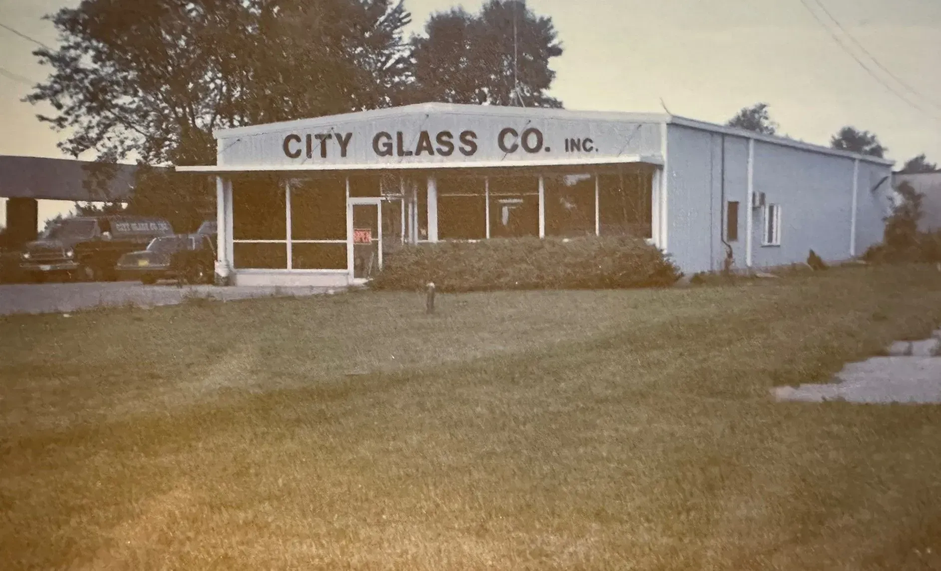 A black and white photo of the city glass co. inc.