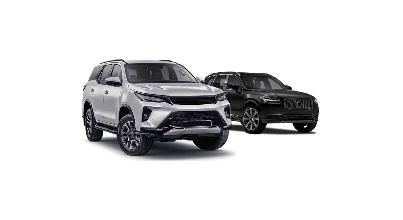 Two cars are parked next to each other on a white background.