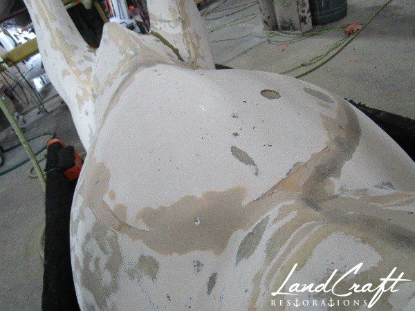 Top Cow art piece statue fiberglass structural repairs in process