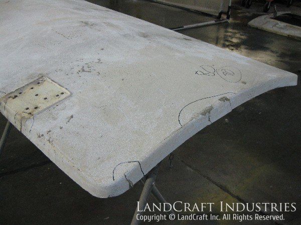 Damaged fiberglass panel from a VOR antenna shelter