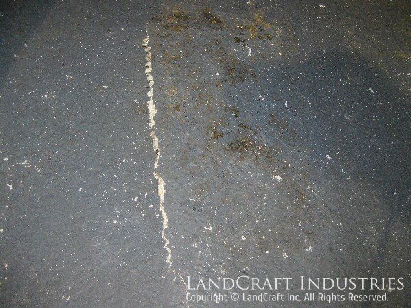 Fiberglass damage on boom lift bucket