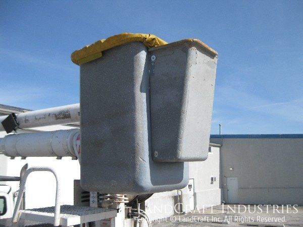 Damaged fiberglass control panel on a boom bucket