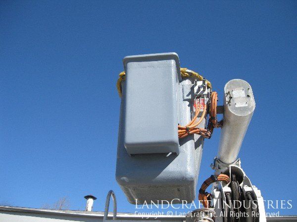 Repaired fiberglass control panel on a boom bucket