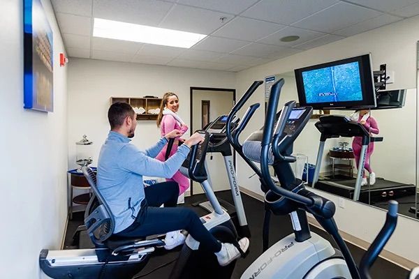 Couple having a workout inside the hotel at River Inn at Seaside, OR