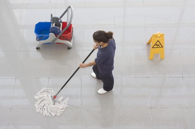cleaner mopping the floor