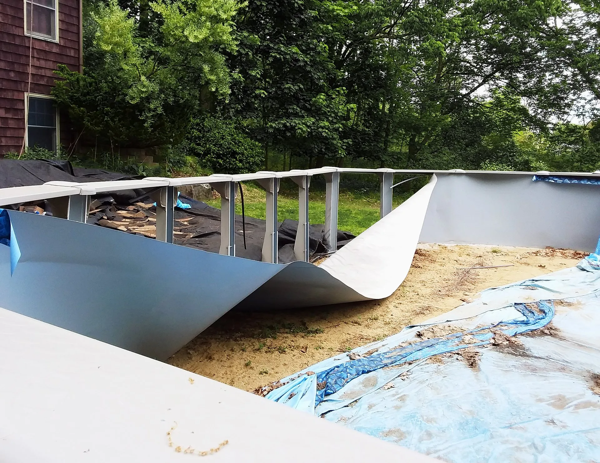 Collapsed above ground pool wall