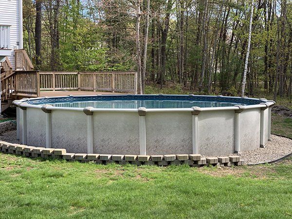 Round Above Ground Pool with Small Deck