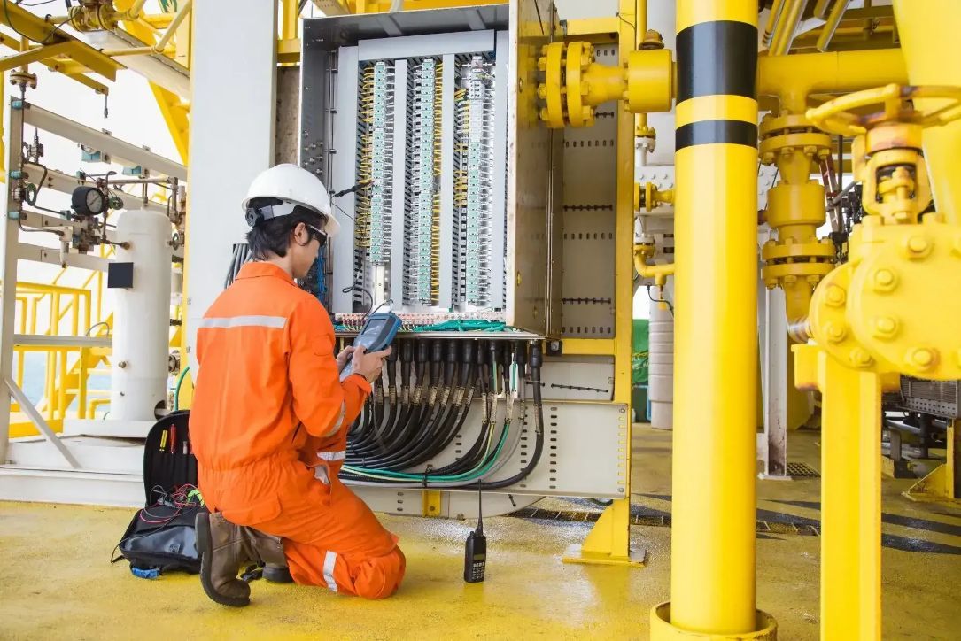 An Electrician in An Orange Jumpsuit  — Peter Gow Electrical in Casino, NSW