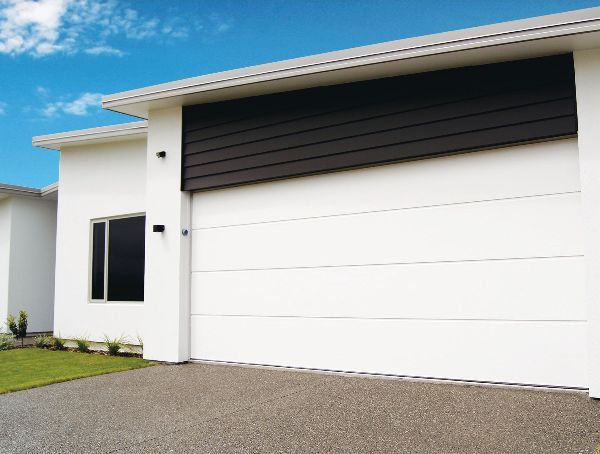 A white house with a large garage door