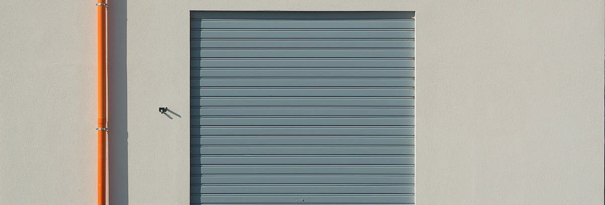 A close up of a garage door on a building.