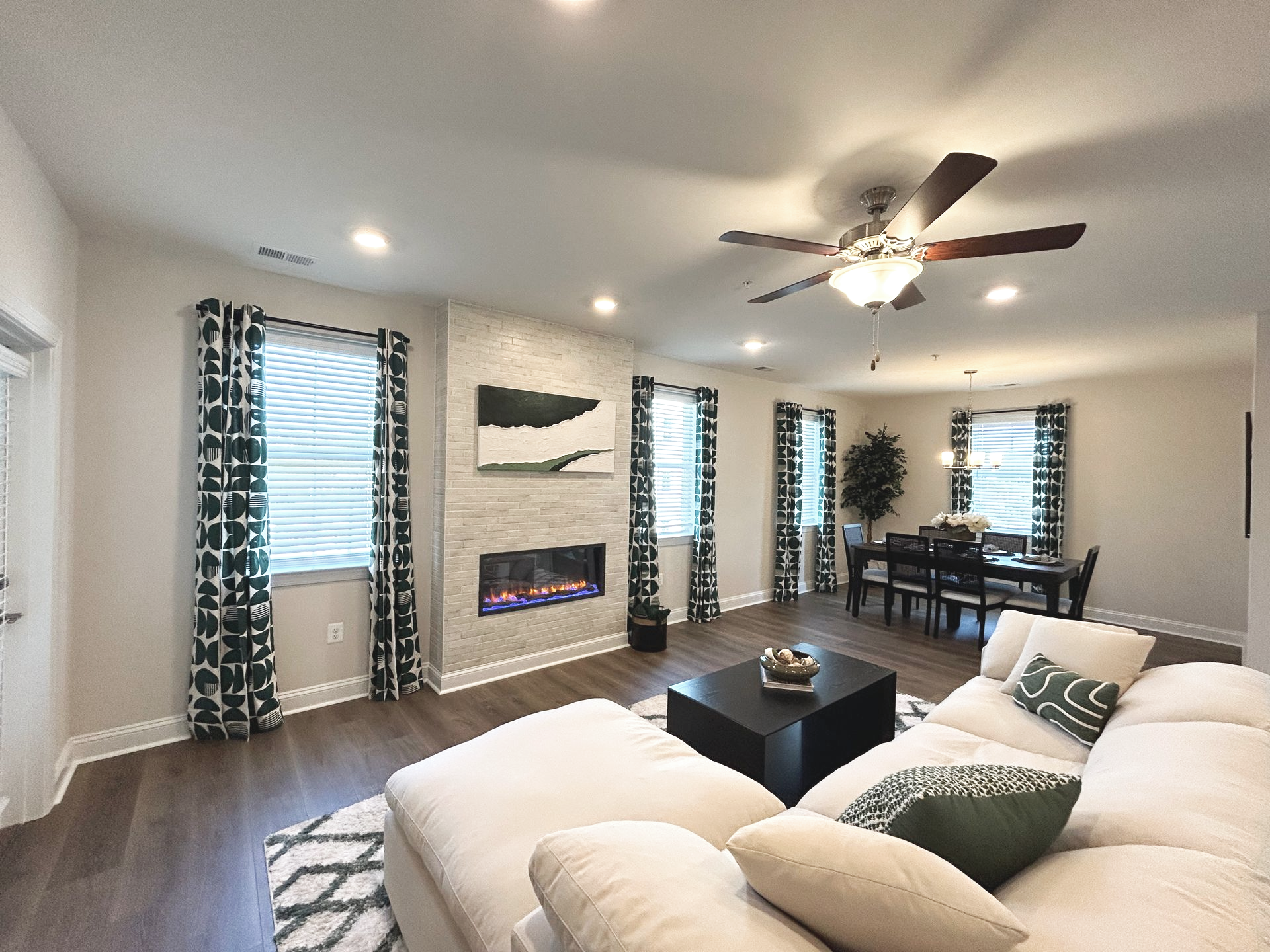 Open-concept living room in the Darlington residence, designed for maintenance-free condo living close to APG