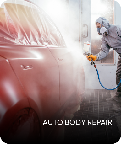 Car being painted by a worker in a spray booth. | Mid Atlantic Autoworks