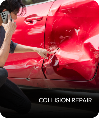 Person on phone points to damage on red car door; collision repair. | Mid Atlantic Autoworks