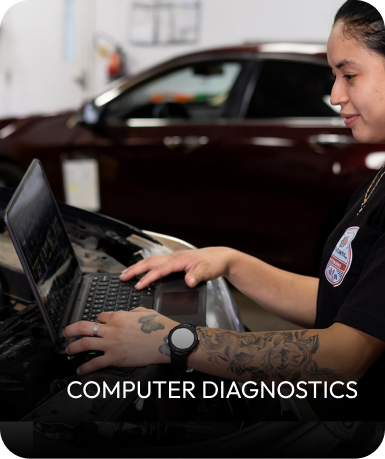 Mechanic using a laptop for computer diagnostics on a car. | Mid Atlantic Autoworks