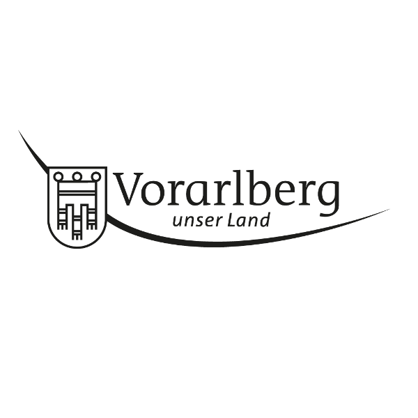 Logo von Vorarlberg, Österreich, mit einem stilisierten Wappen und dem Text „Vorarlberg unser Land“.