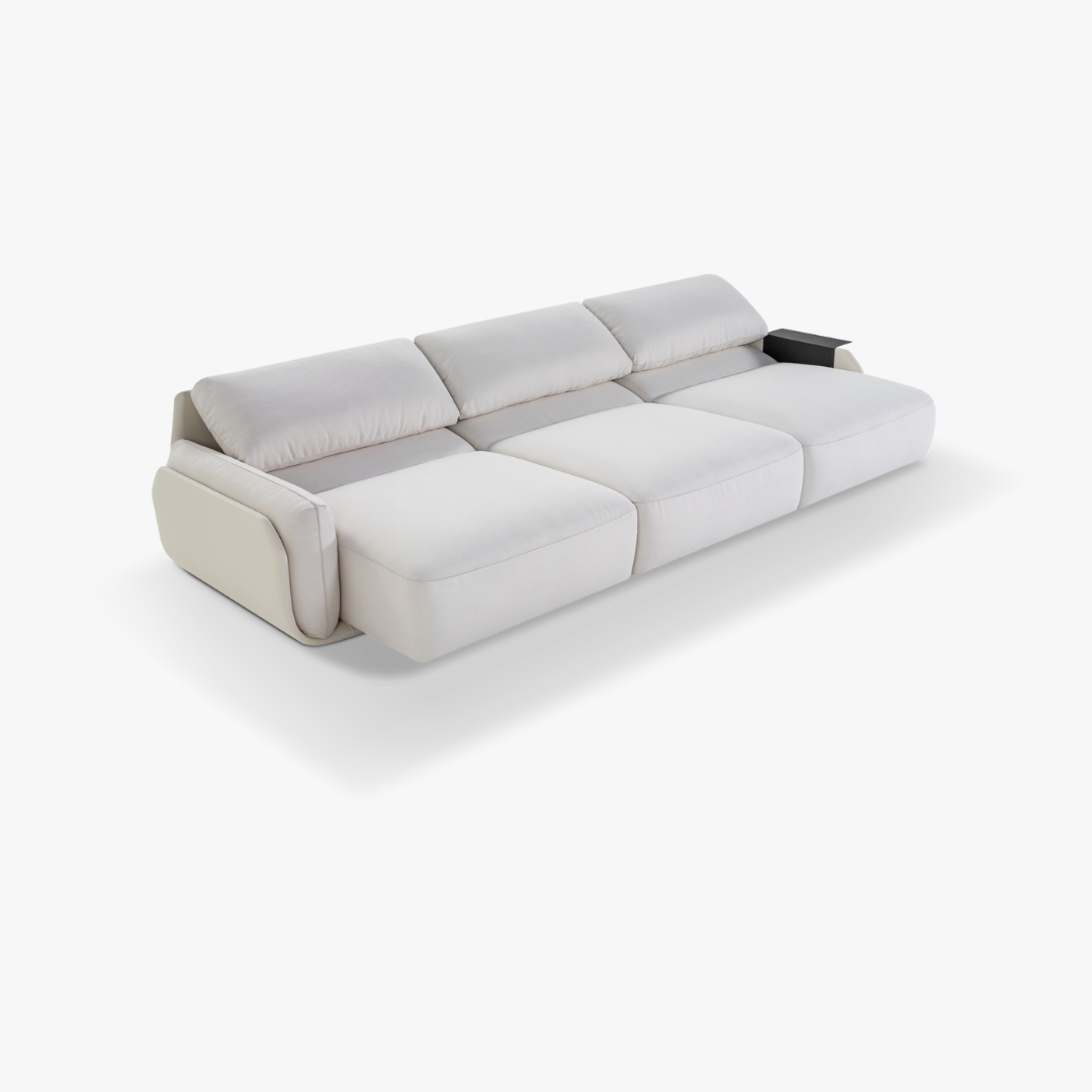 Um sofá branco está sobre uma superfície branca.