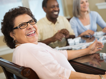 Group of Seniors Playing Dominoes — Hillsborough, NC — Adorable Senior Living