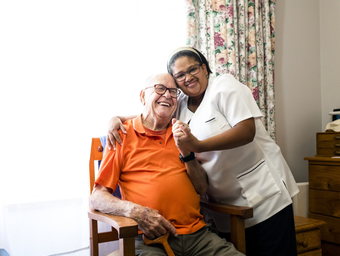 Smiling Caregiver and Senior — Hillsborough, NC — Adorable Senior Living